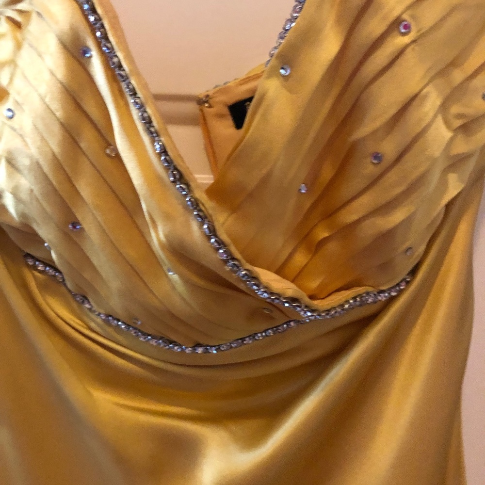 Betsy Johnson Gown. Satin-like fabric with Rhinestones at top of gown.